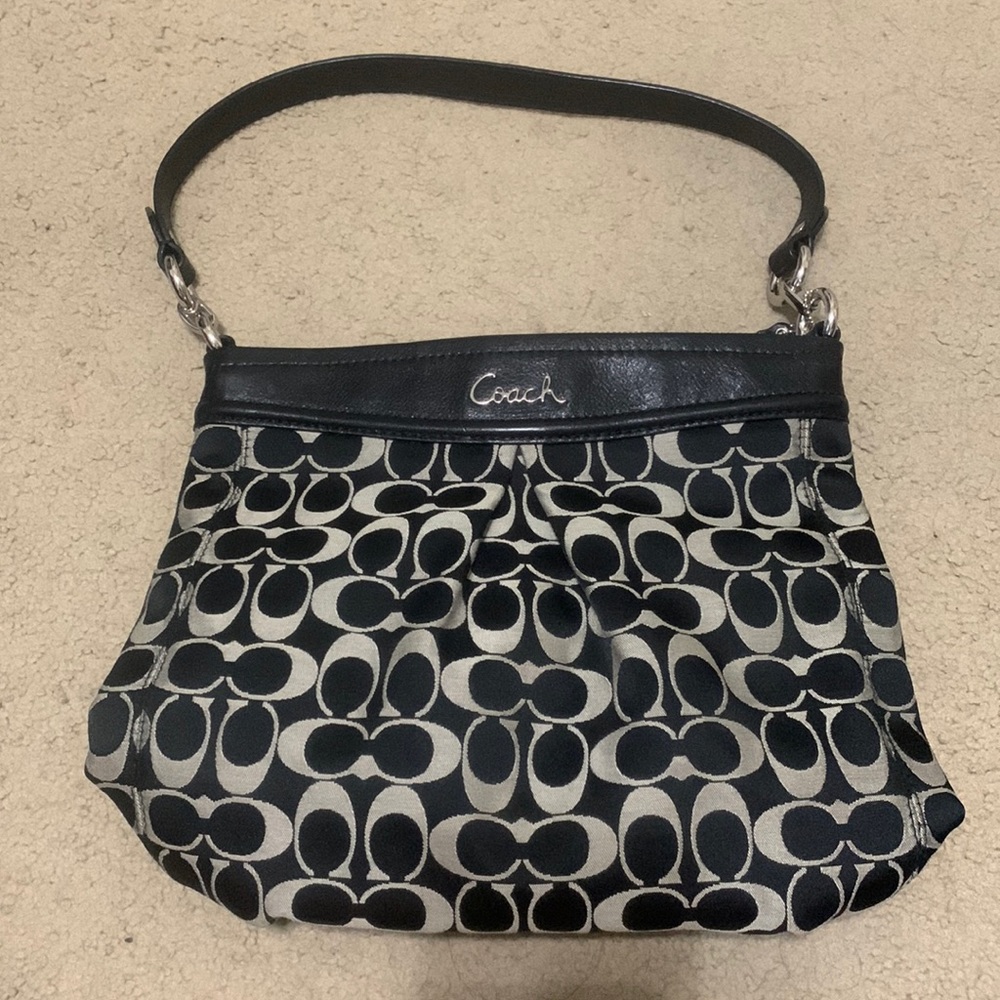 Coach purse with black and tannish gray signature print